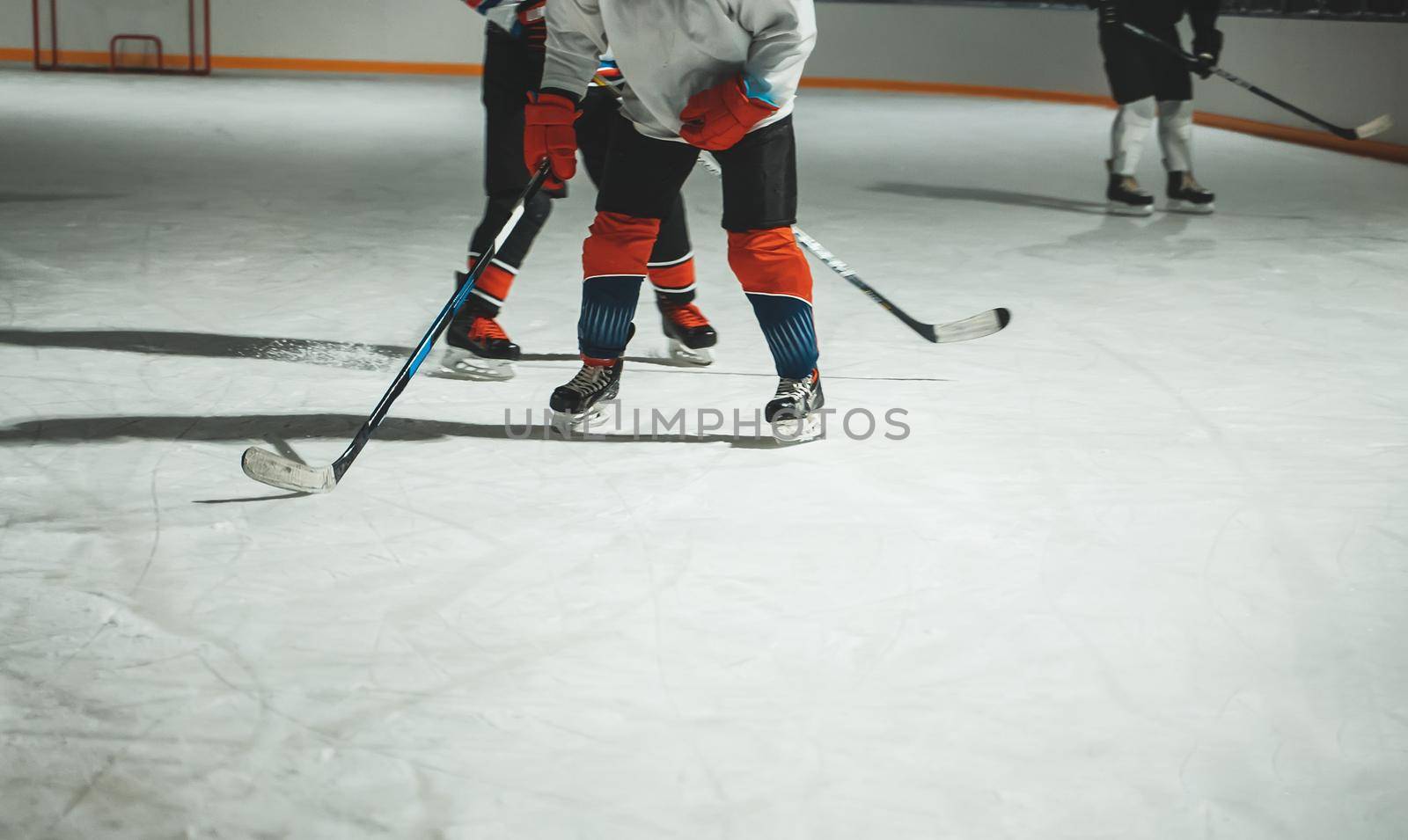 People play hockey outdoors in winter time.