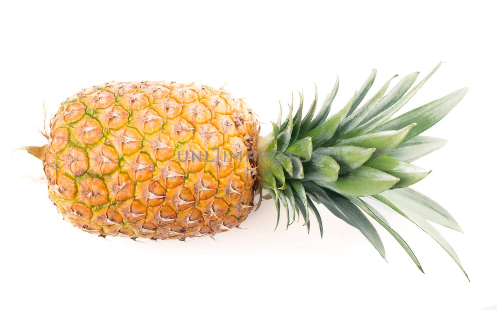 Ripe whole pineapple isolated on white.
