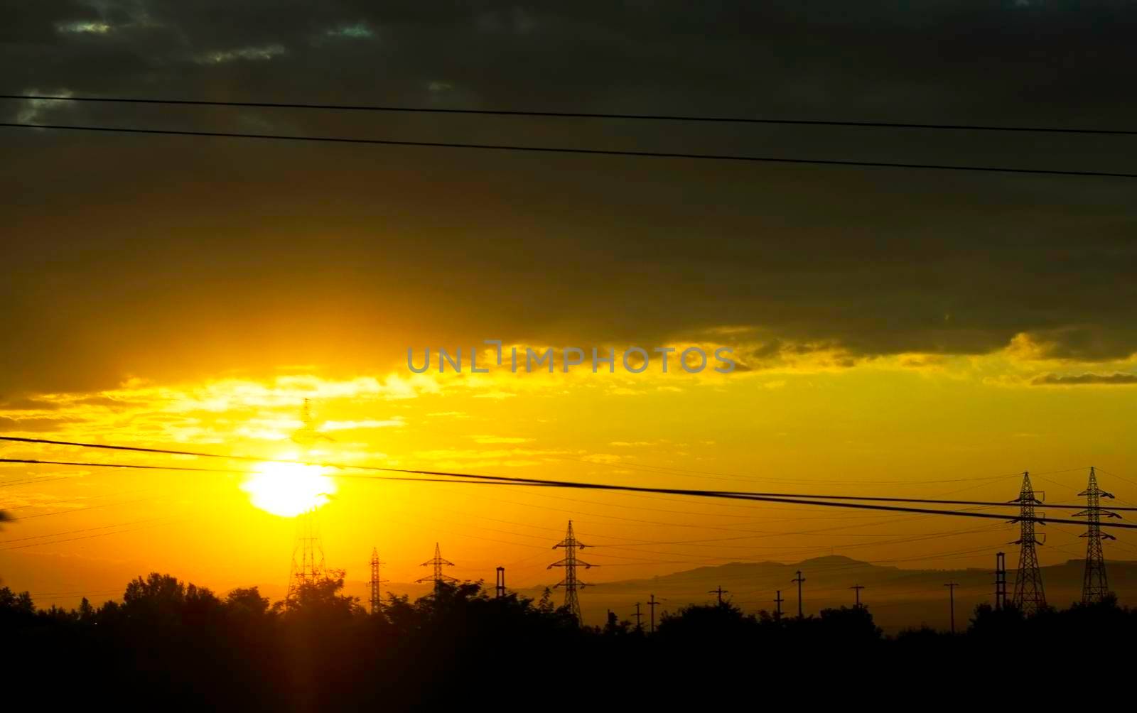 High voltage power lines in the sunrise