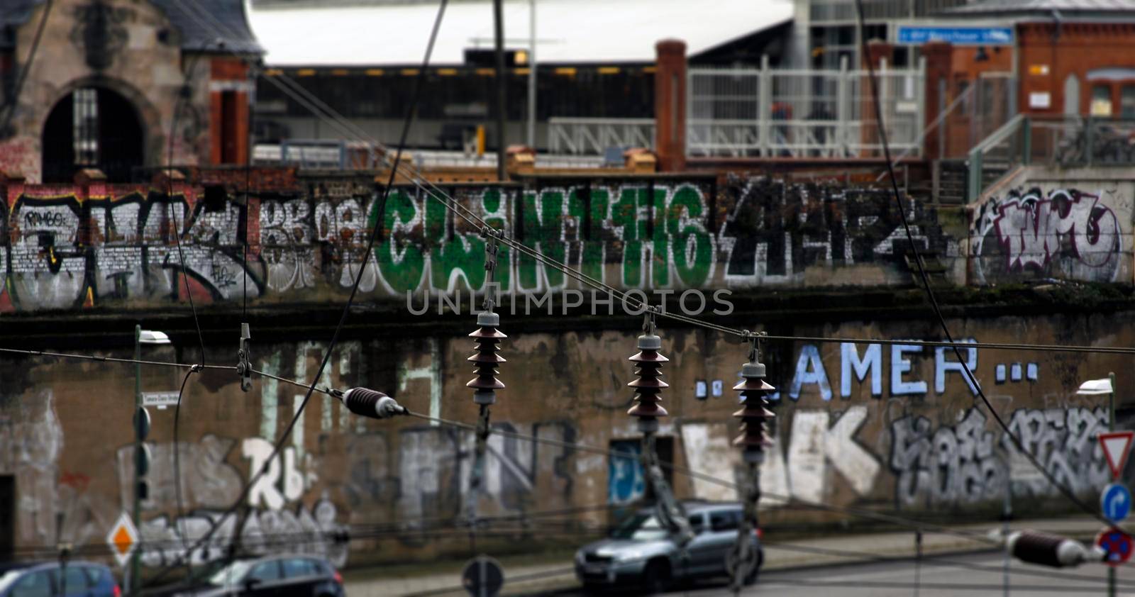 Abstract background with electricity wire over a graffity wall, facade in Berlin