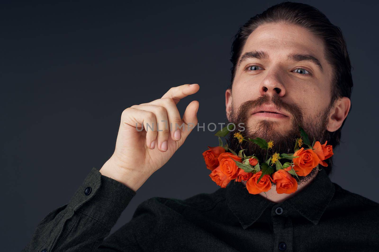 man flowers decoration in beard emotions black background by SHOTPRIME