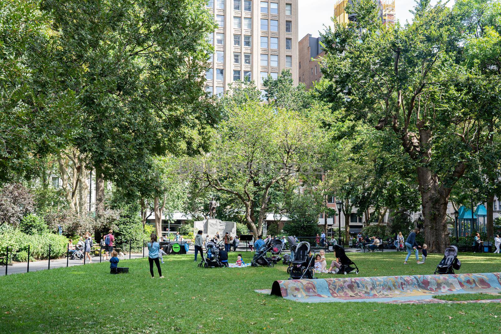 New York City, USA - September 20, 2019: People relaxing in Madison Square Park.