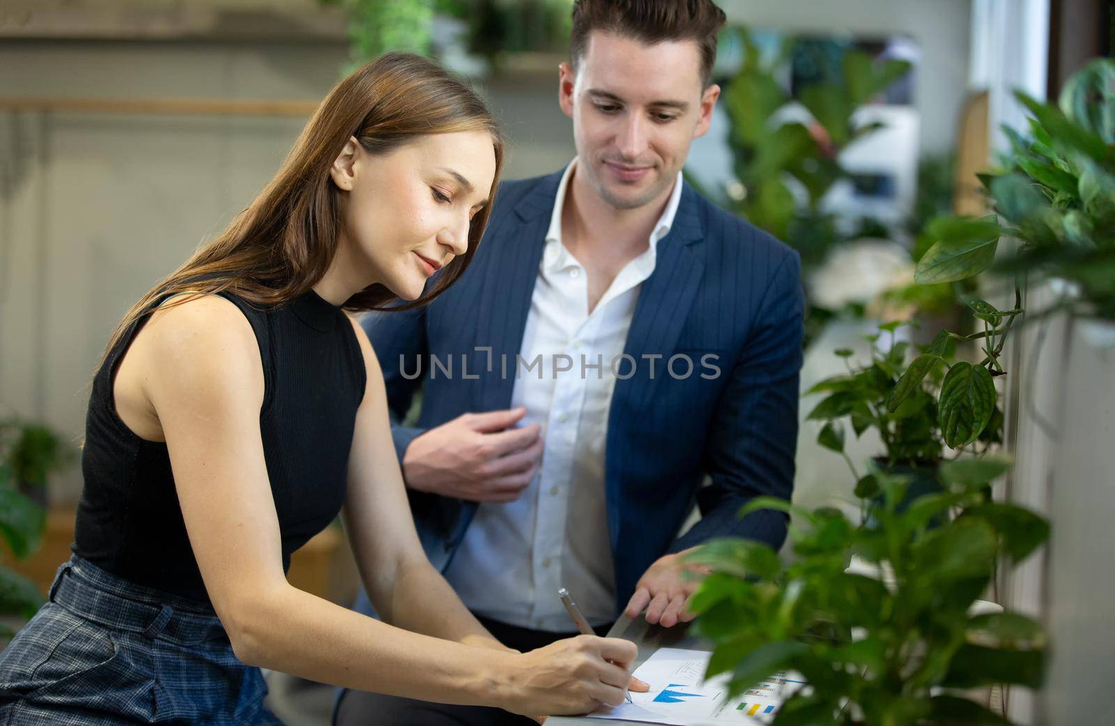 Business people talking in office using digital tablet and computer 