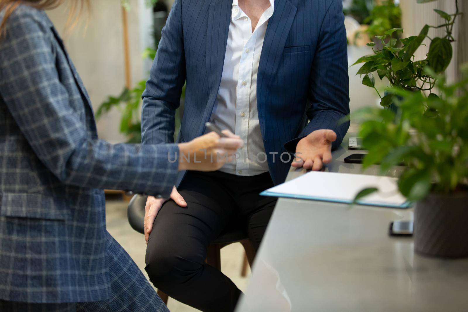 Business people talking in office using digital tablet and computer 