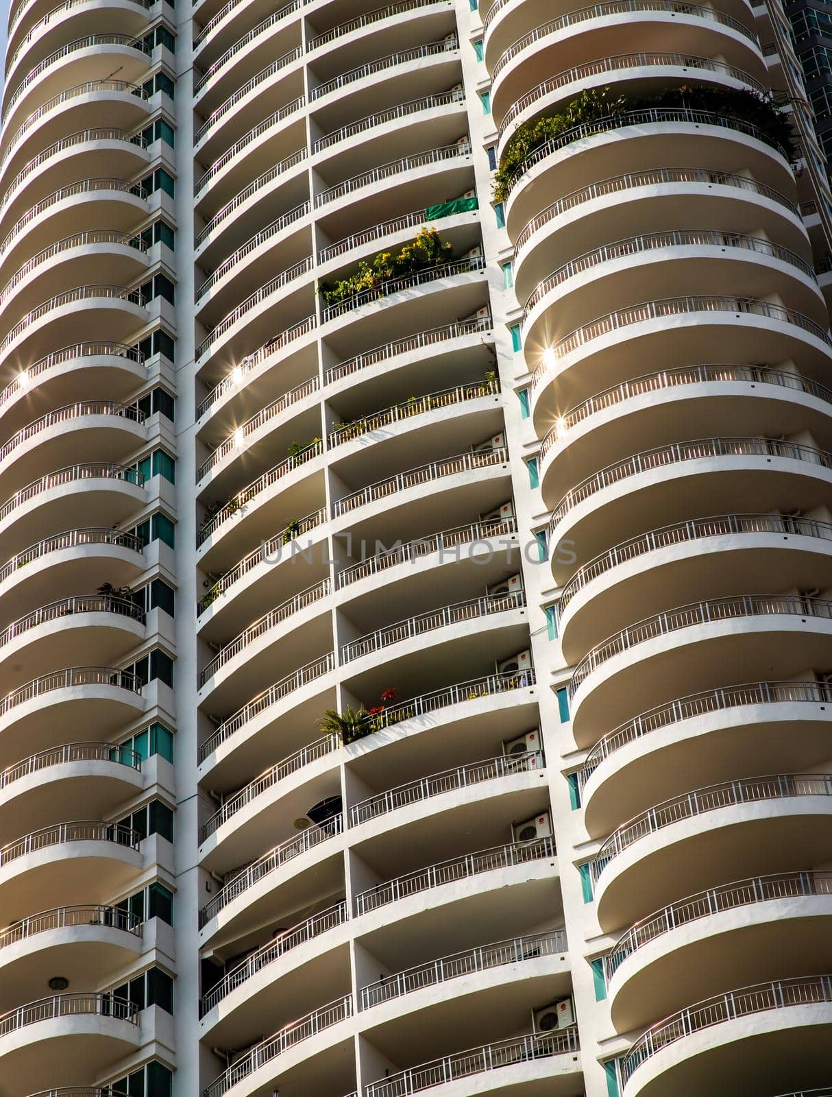 Bangkok, Thailand - 18 Jan 2021 : Low angle looking up at Condominium building with repeating structure. Architecture concept. Selective focus.