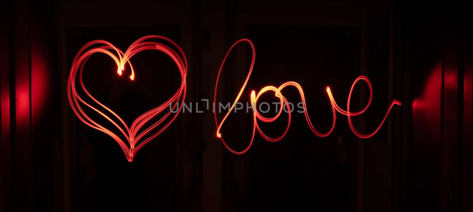 Red light track writing love and drawing a heart. by maramade