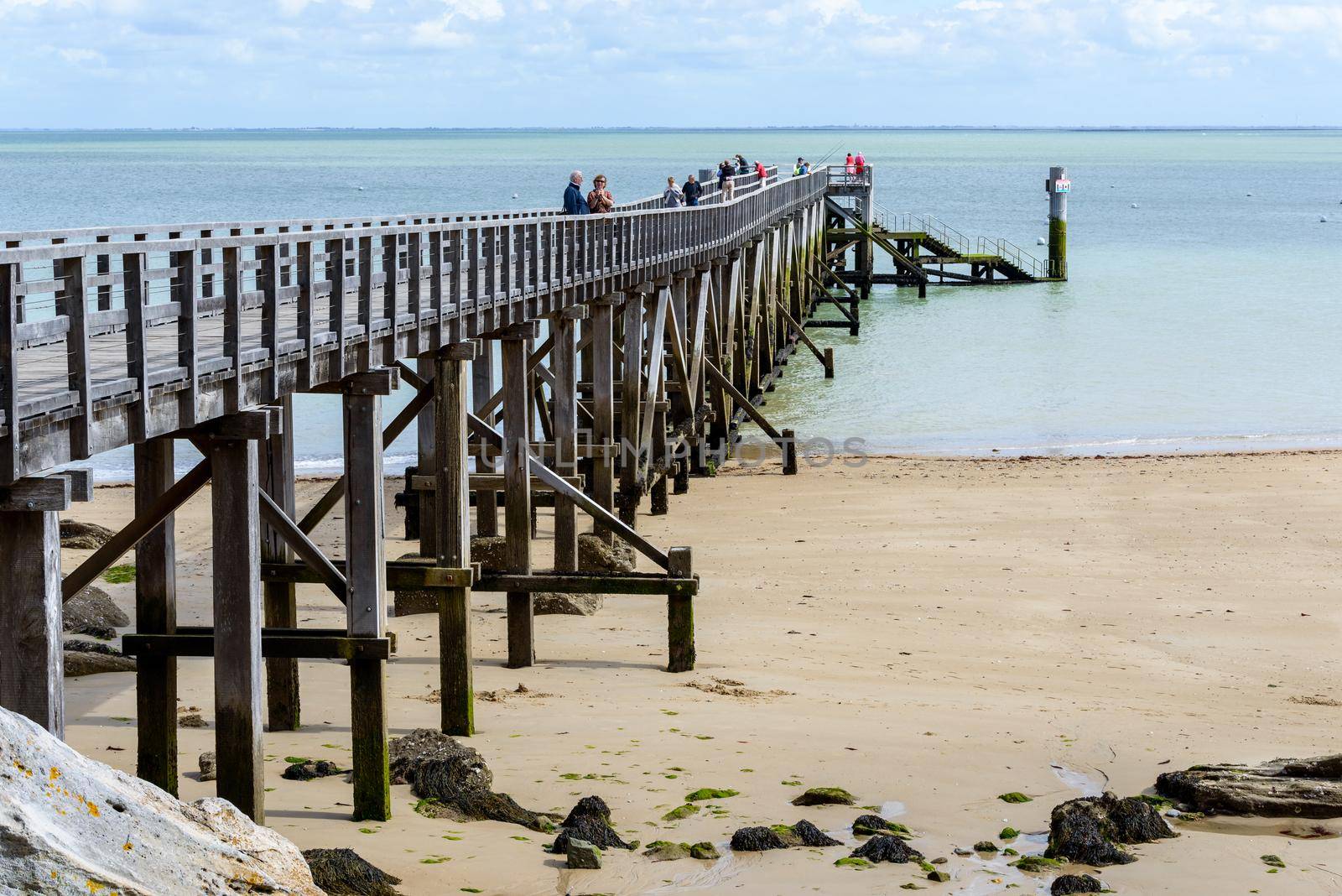 Pier on the island of Noirmoutier, France by dutourdumonde