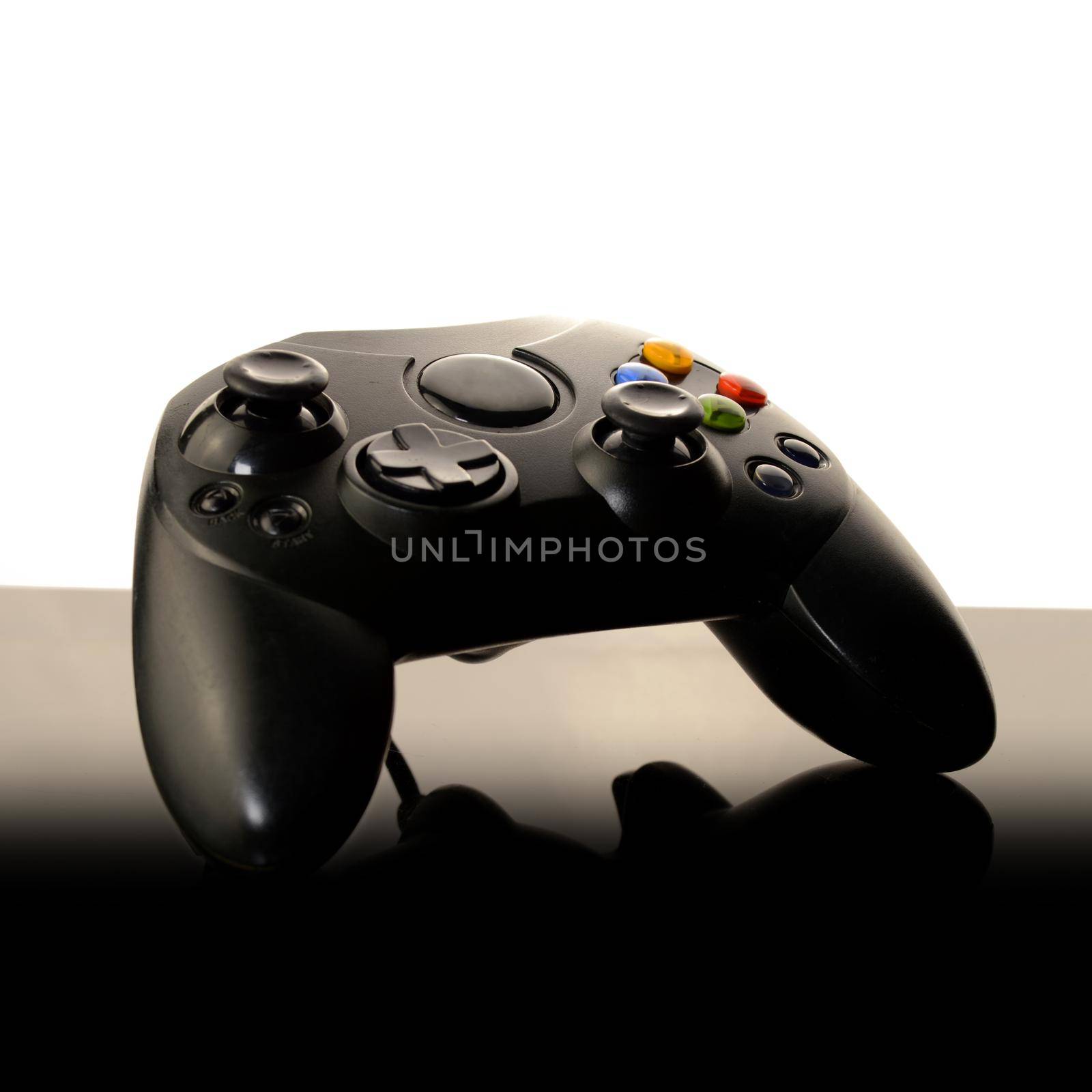 A stylish closeup of a video game controller with a white page bleed for edits.