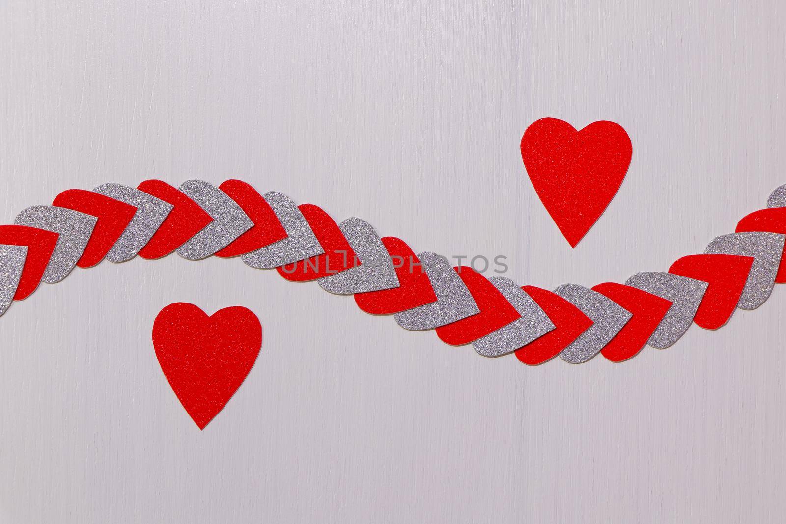 Saint Valentine's day love theme design with red hearts and heart string on textured white background
