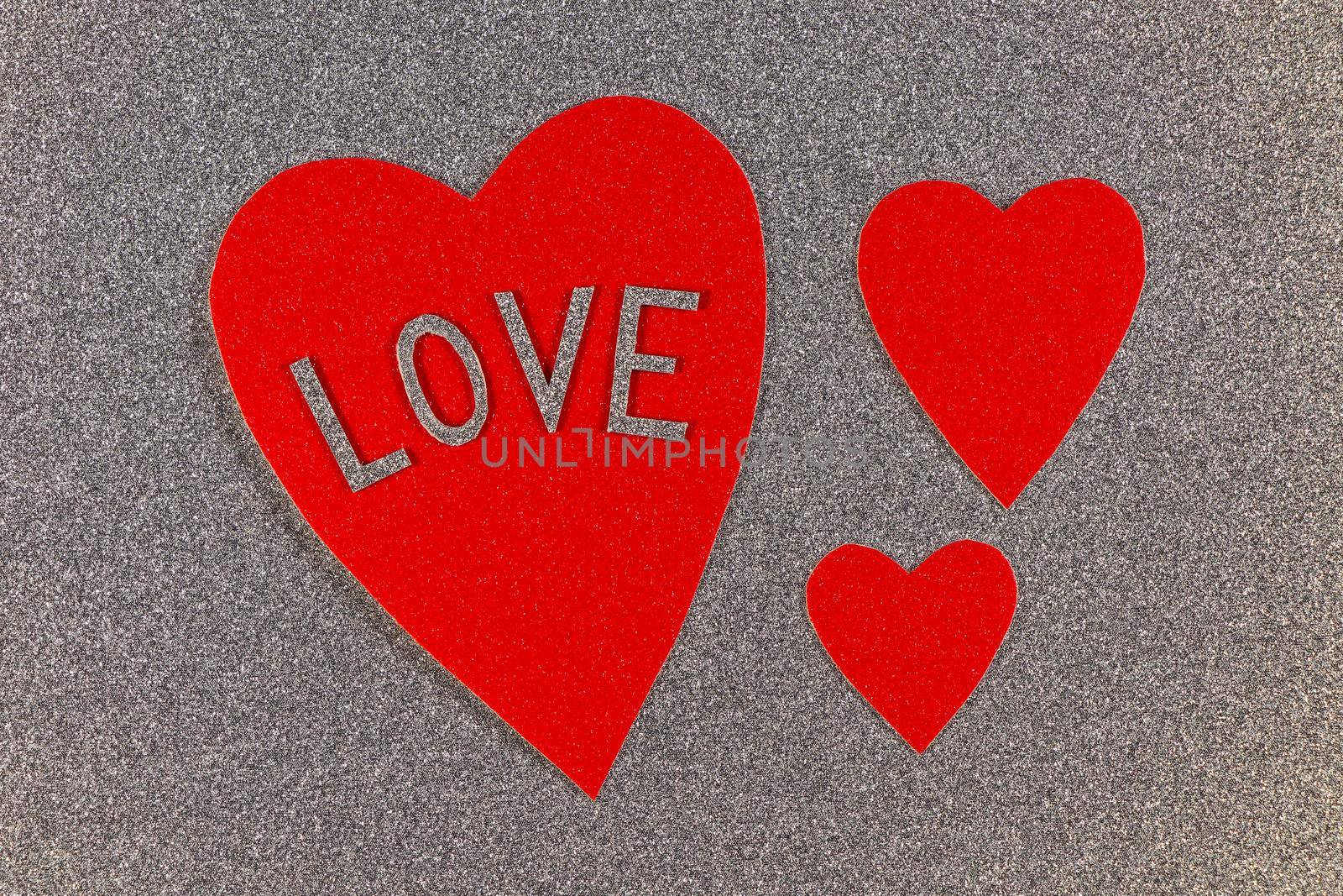 Saint Valentine's day red hearts love design on silver background