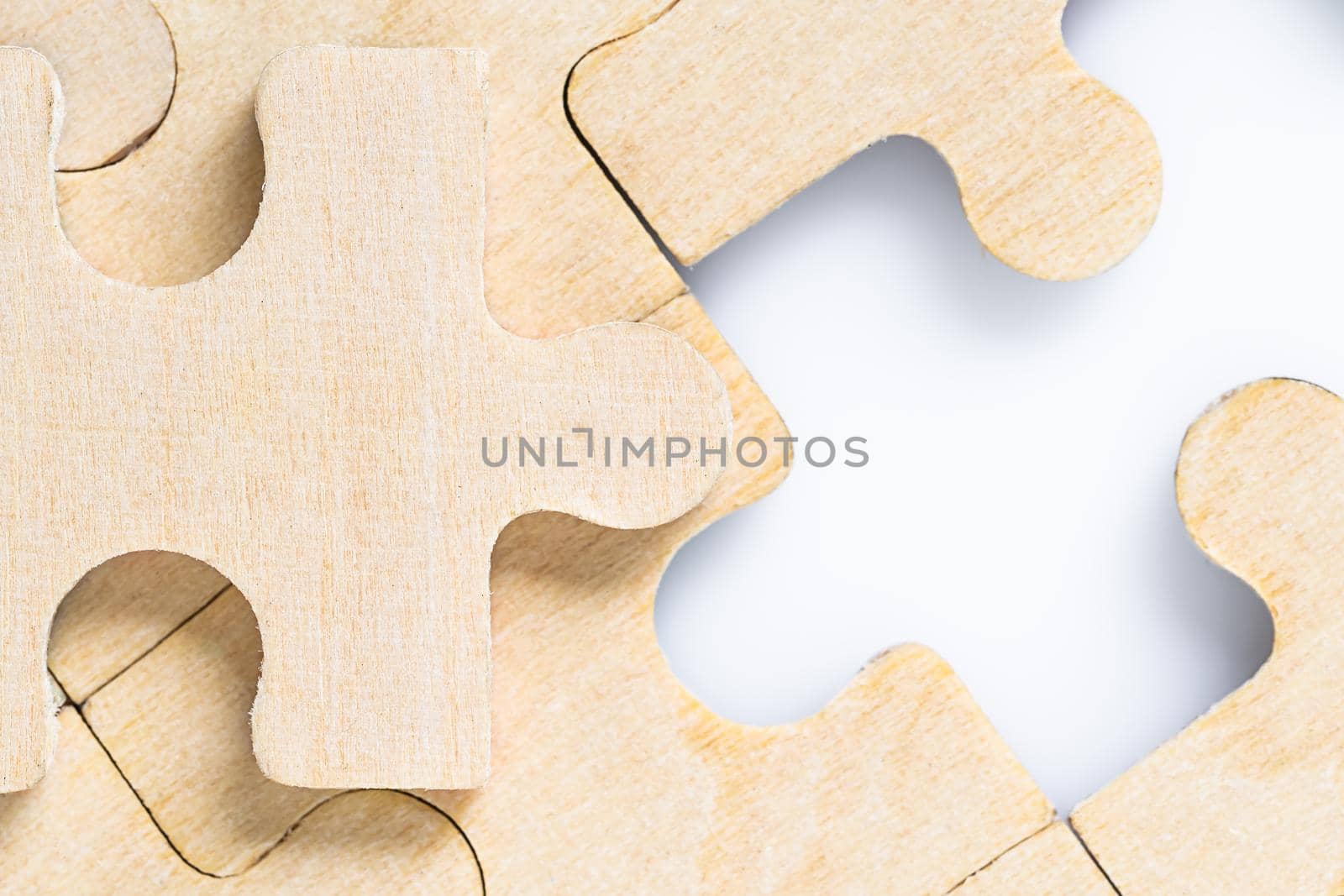 Close up shot of Missing jigsaw puzzle pieces on white background,business concept