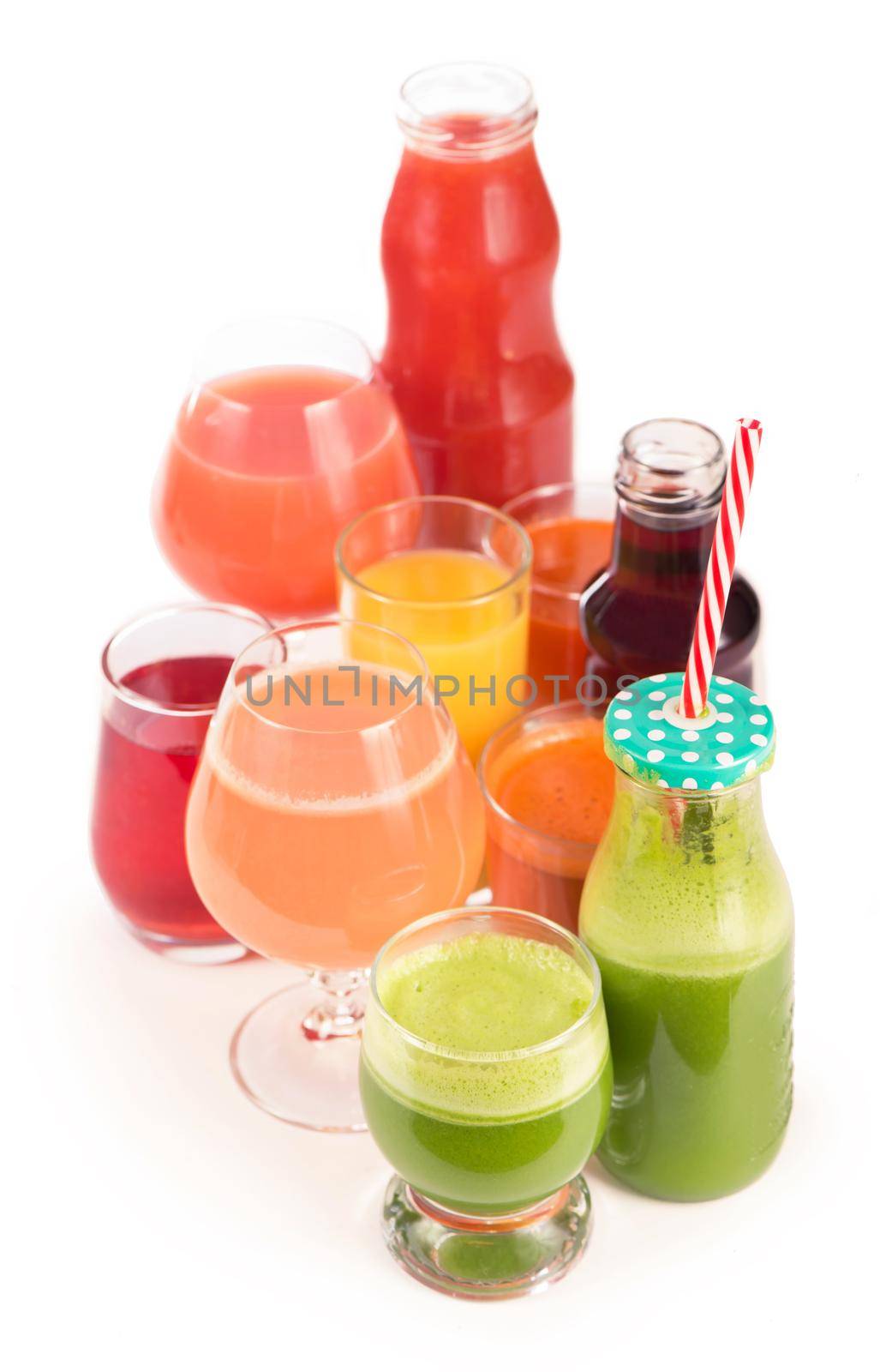 Glasses with fresh organic vegetable and fruit juices isolated on white. by aprilphoto