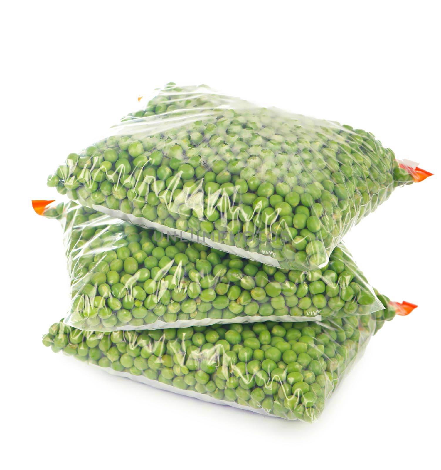 Composition with organic frozen vegetables on white background. Green peas in the package