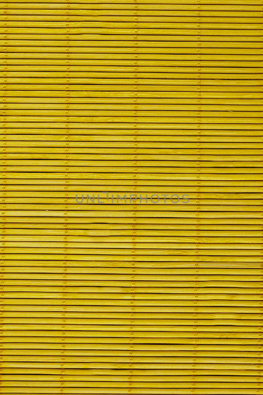 Close-up of the wooden blinds on the mustard-colored windows.Texture or background
