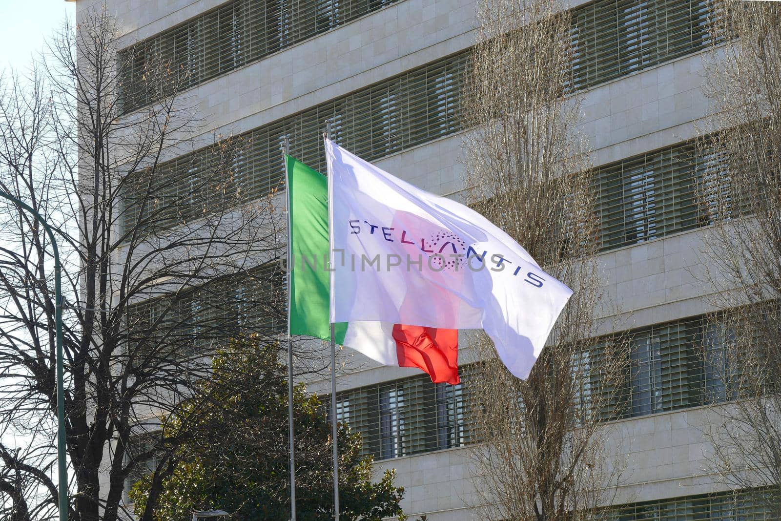Stellantis corporation flag at italian headquarters after merging between Groupe PSA and FCA automotive Turin Italy January 25 2021 by lemar