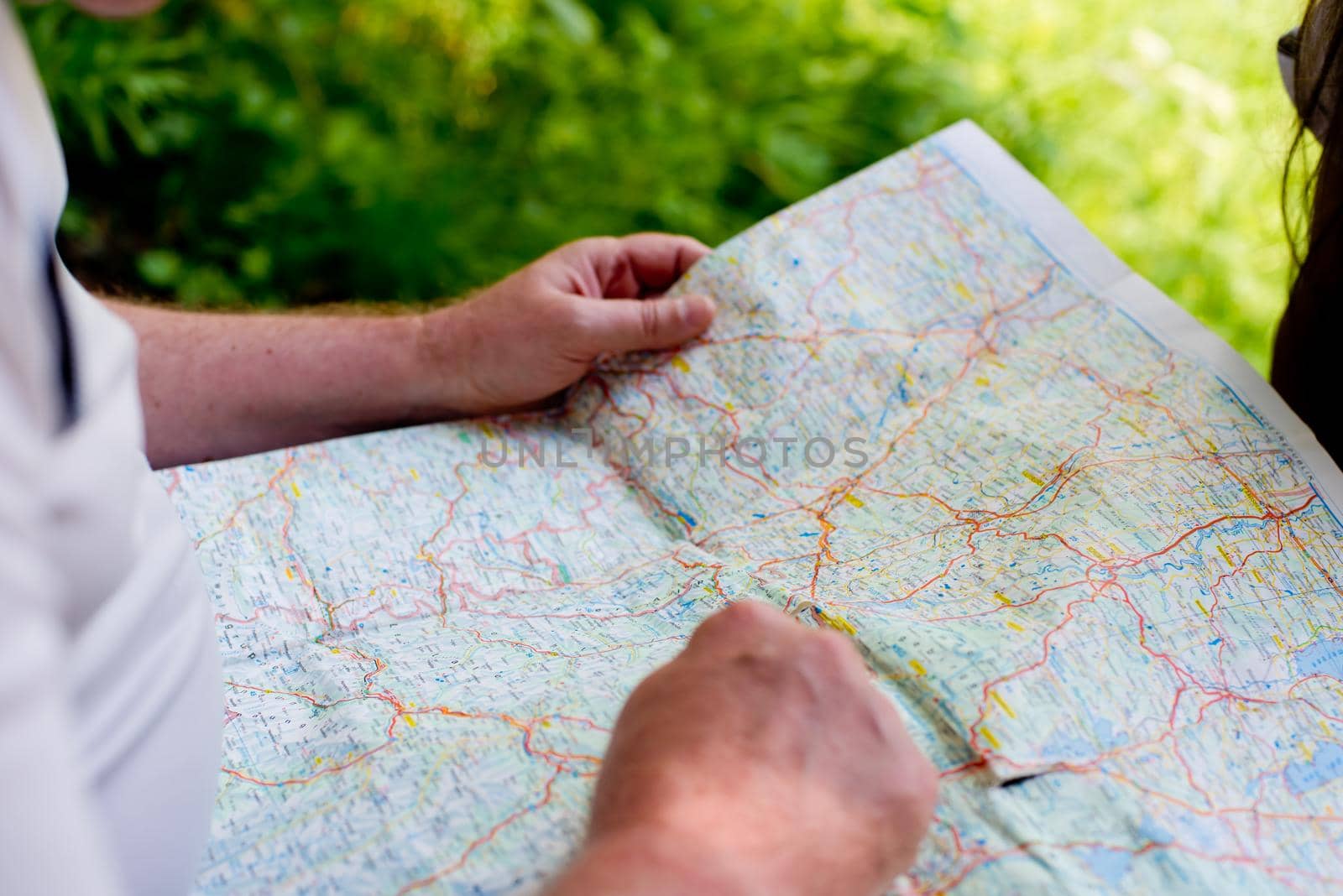 A man looks at the map. Close-up.