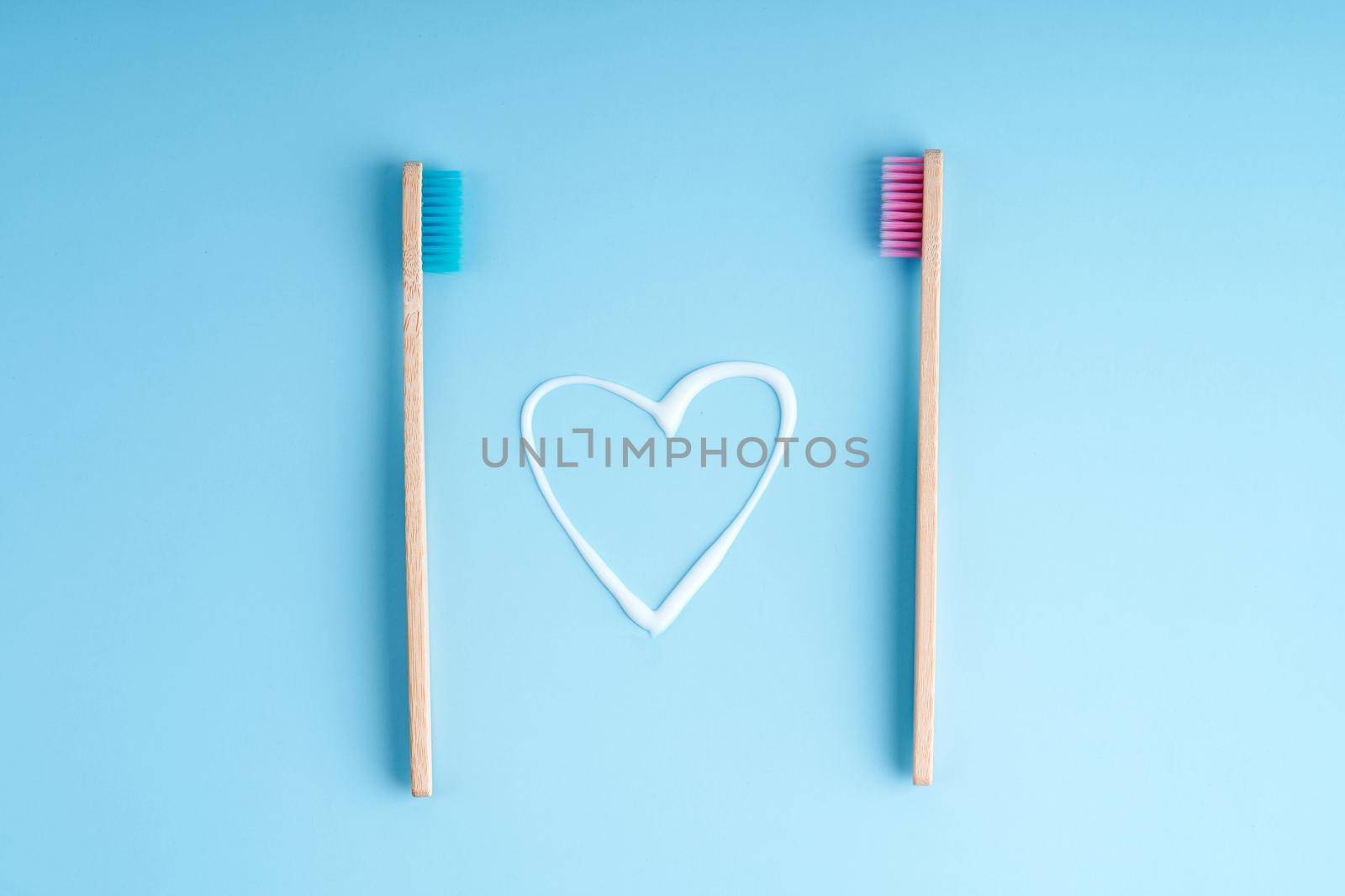 A pair of eco-friendly bamboo toothbrushes. Global environmental trends. Toothbrushes of different genders.