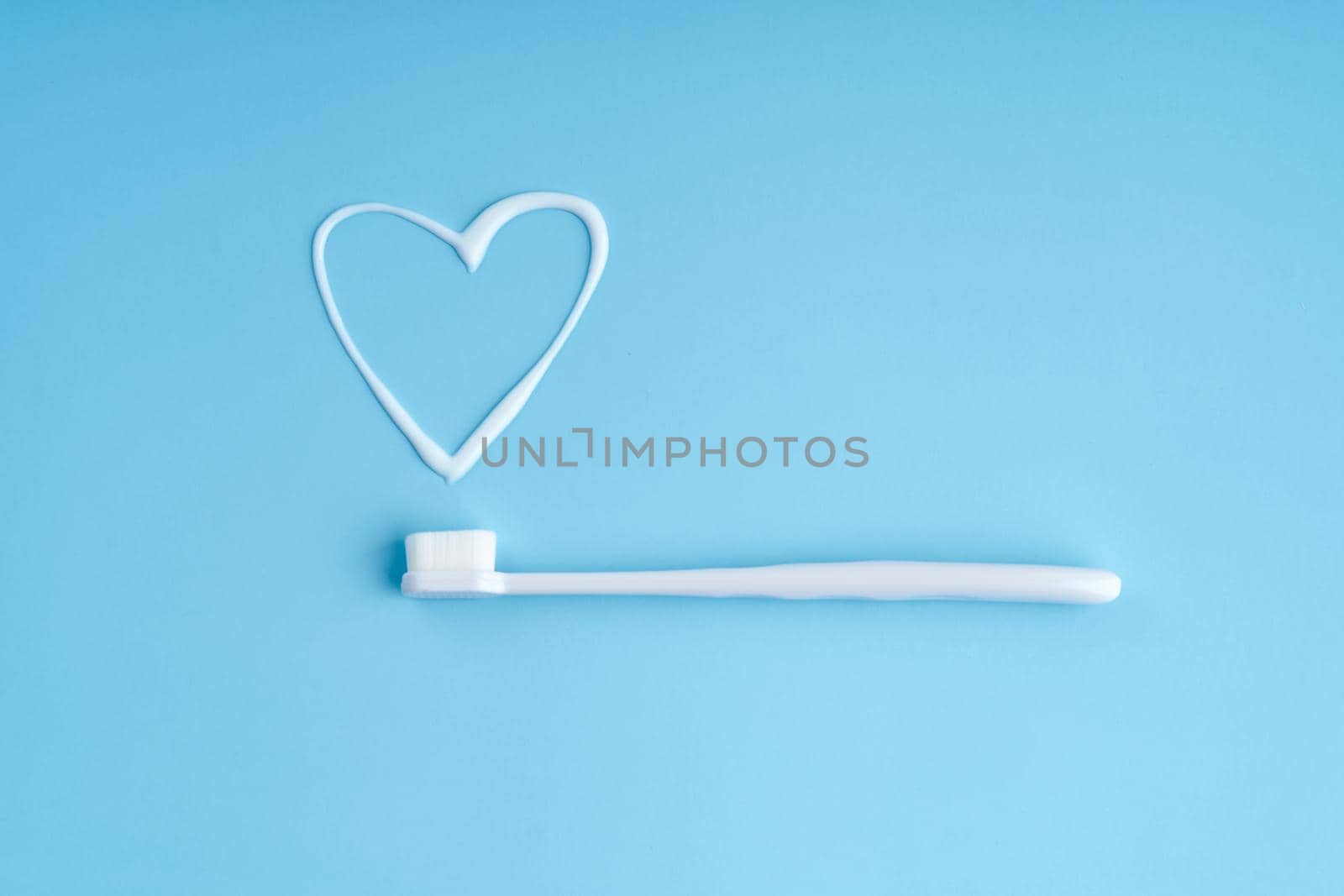 Trendy toothbrush with soft bristles. Popular toothbrushes. Hygiene trends. Top view with toothpaste by Try_my_best