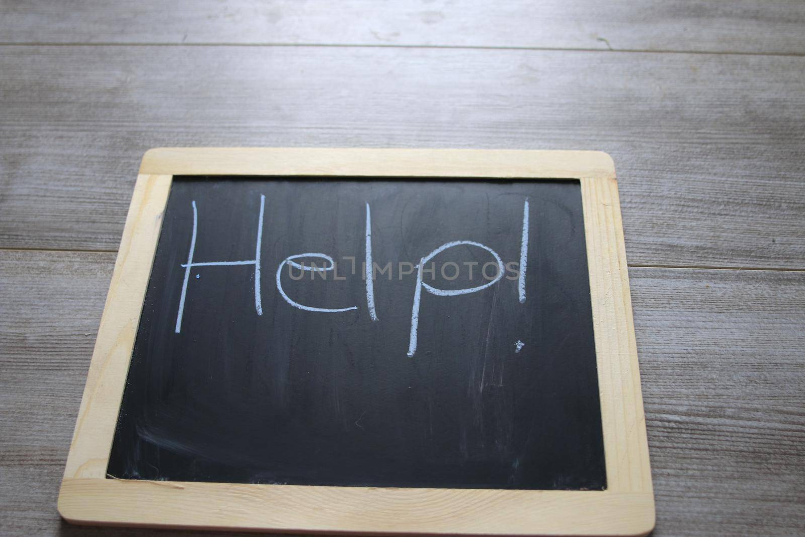 help wrote on a chalkboard, theme of depression or mental illness. High quality photo