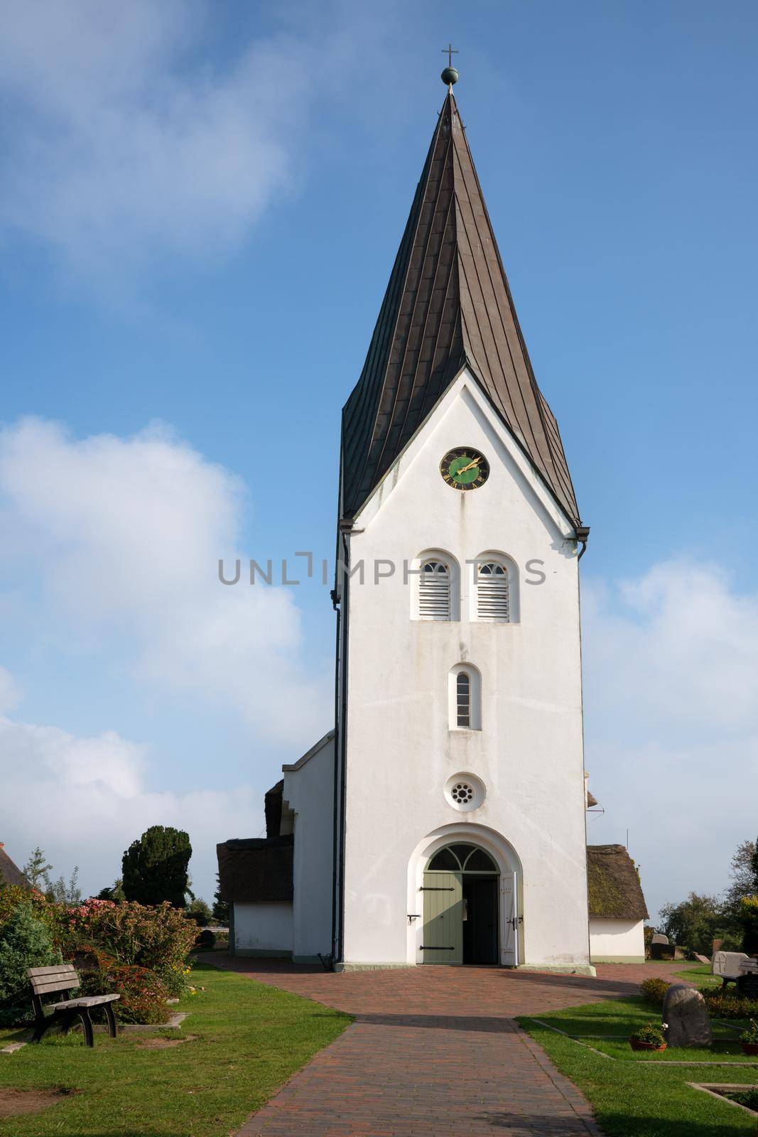 Old church of Nebel against blue sky, Amrum, Germany