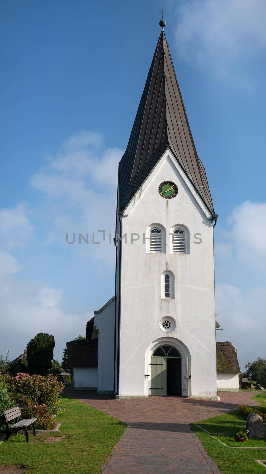 Old church of Nebel against blue sky, Amrum, Germany