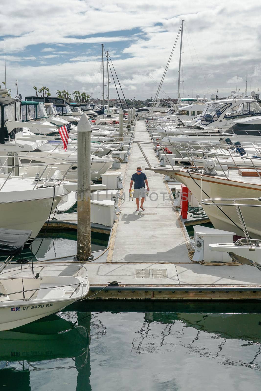 Boats moored at Embarcadero Marina Park North, San Diego. Boat, yachts, ship and sail docked at the harbor. Marina with anchored luxury boats. California. USA. January 16th, 2021