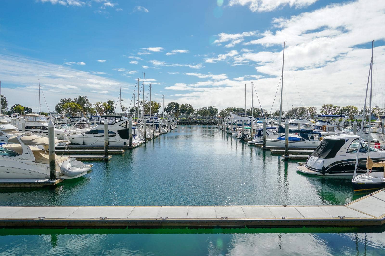 Boats moored at Embarcadero Marina Park North, San Diego. Boat, yachts, ship and sail docked at the harbor. Marina with anchored luxury boats. California. USA. January 16th, 2021