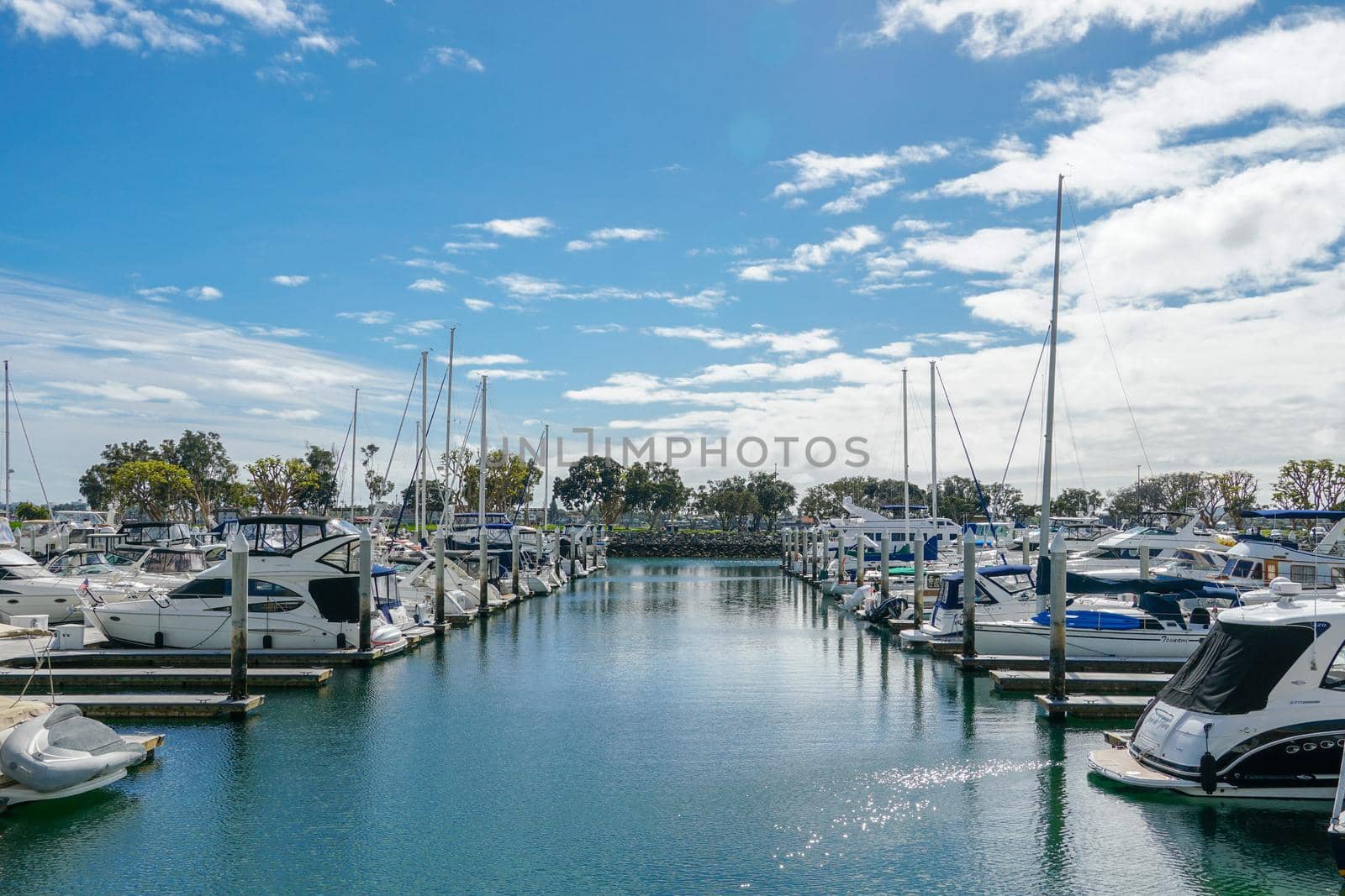 Boats moored at Embarcadero Marina Park North, San Diego. Boat, yachts, ship and sail docked at the harbor. Marina with anchored luxury boats. California. USA. January 16th, 2021