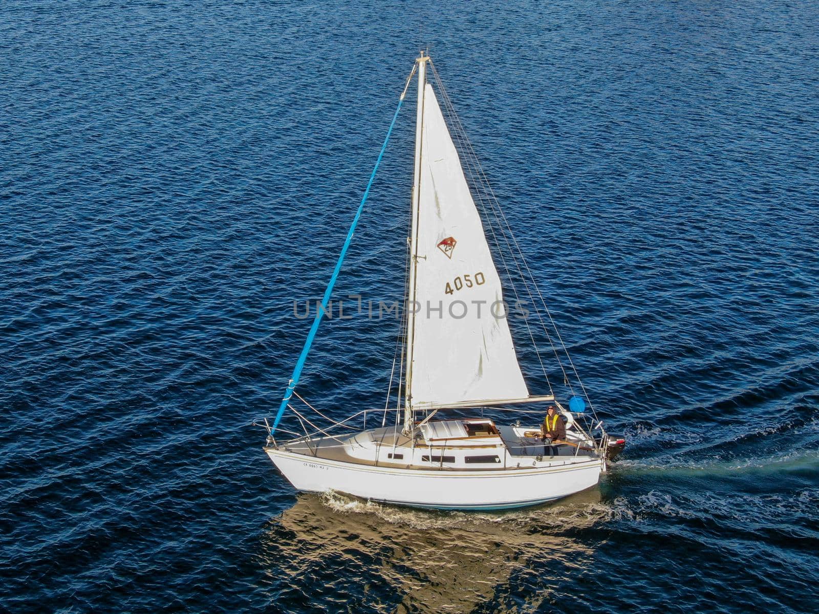 Aerial view of small sail boats in the Mission Bay of San Diego, California, USA. Small sailing ship yachts anchored in the bay. March 22nd, 2020