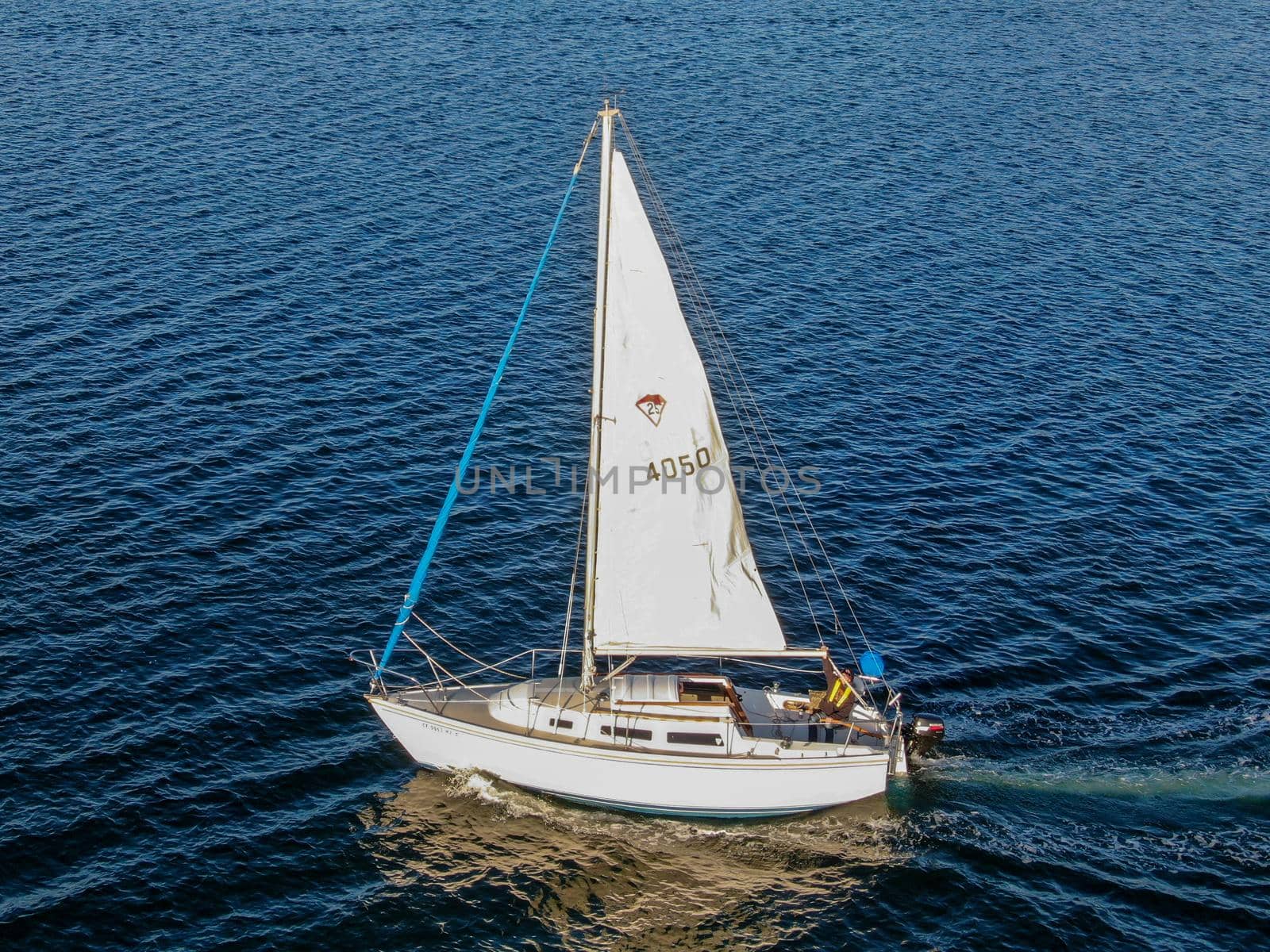 Aerial view of small sail boats in the Mission Bay of San Diego, California, USA. Small sailing ship yachts anchored in the bay. March 22nd, 2020