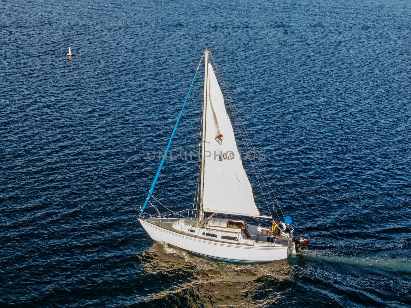 Aerial view of small sail boats in the Mission Bay of San Diego, California, USA. Small sailing ship yachts anchored in the bay. March 22nd, 2020