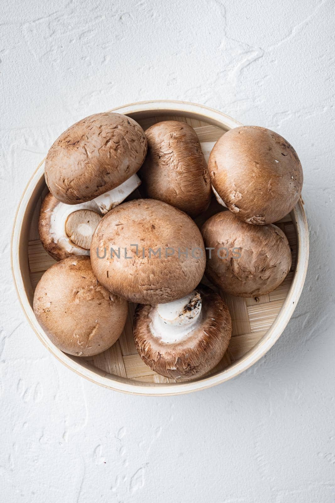 Raw mushrooms champignons set, on white background, top view flat lay