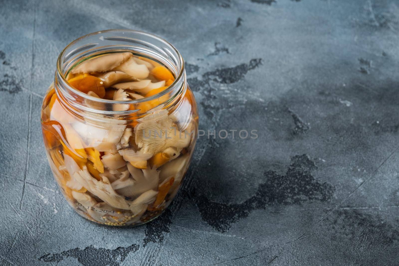 Marinated mushrooms set, on gray background , with space for text copyspace