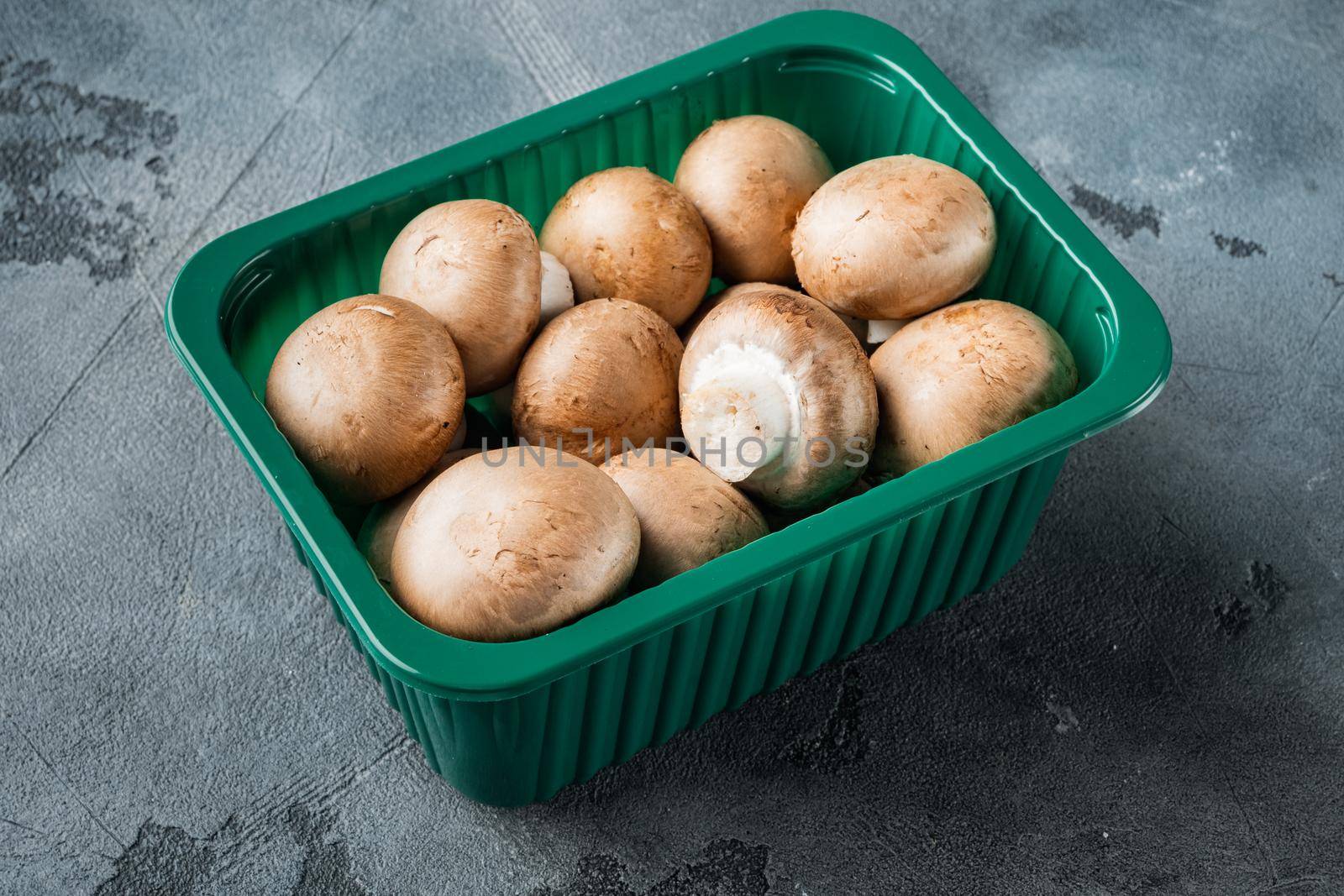 Royal mushrooms champignon whole set, on gray background, in plastic pack