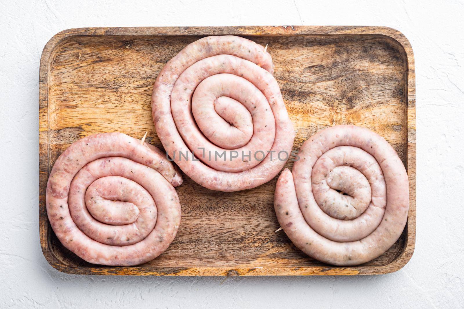 Raw spiral sausage set, on white background, top view flat lay