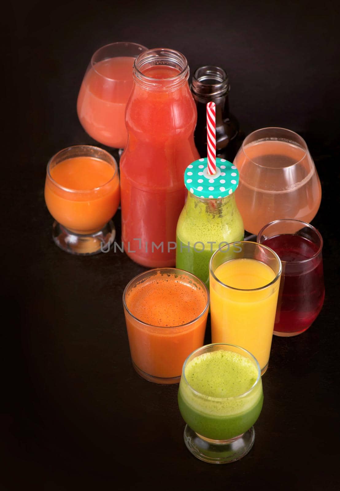 Various freshly squeezed fruits and vegetables juices.