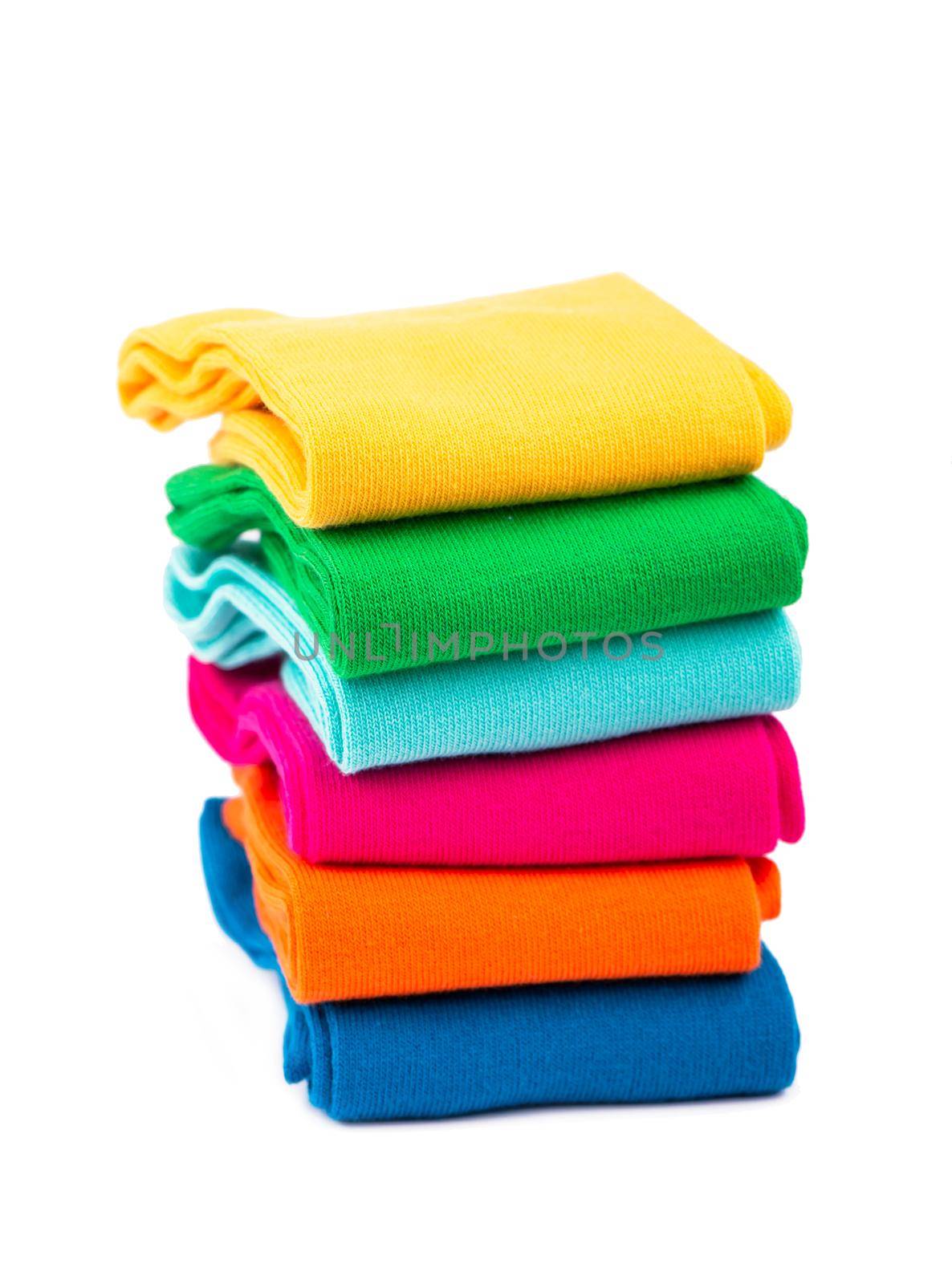Pile of colorful socks on white background by aprilphoto