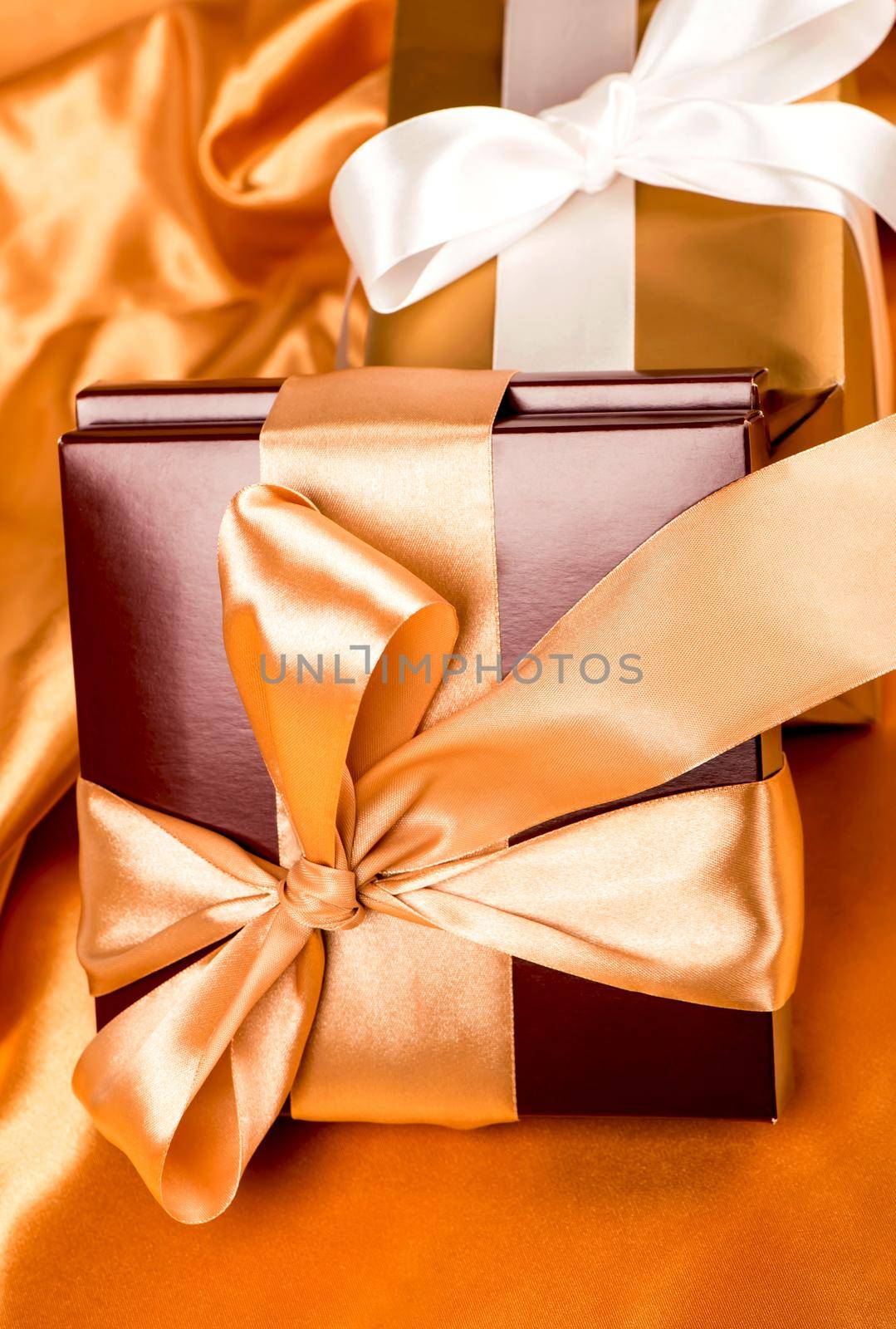 brown box with candies and golden tape by aprilphoto
