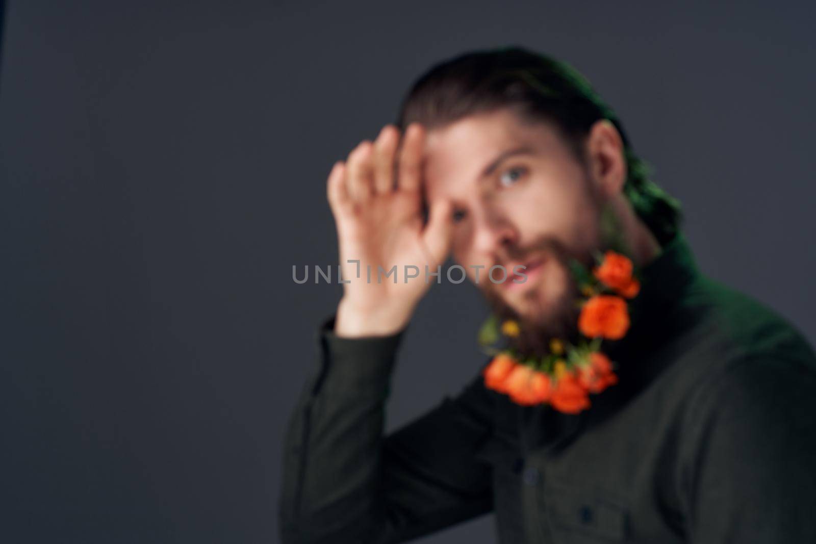 handsome man flowers in a beard decoration romance dark background by SHOTPRIME