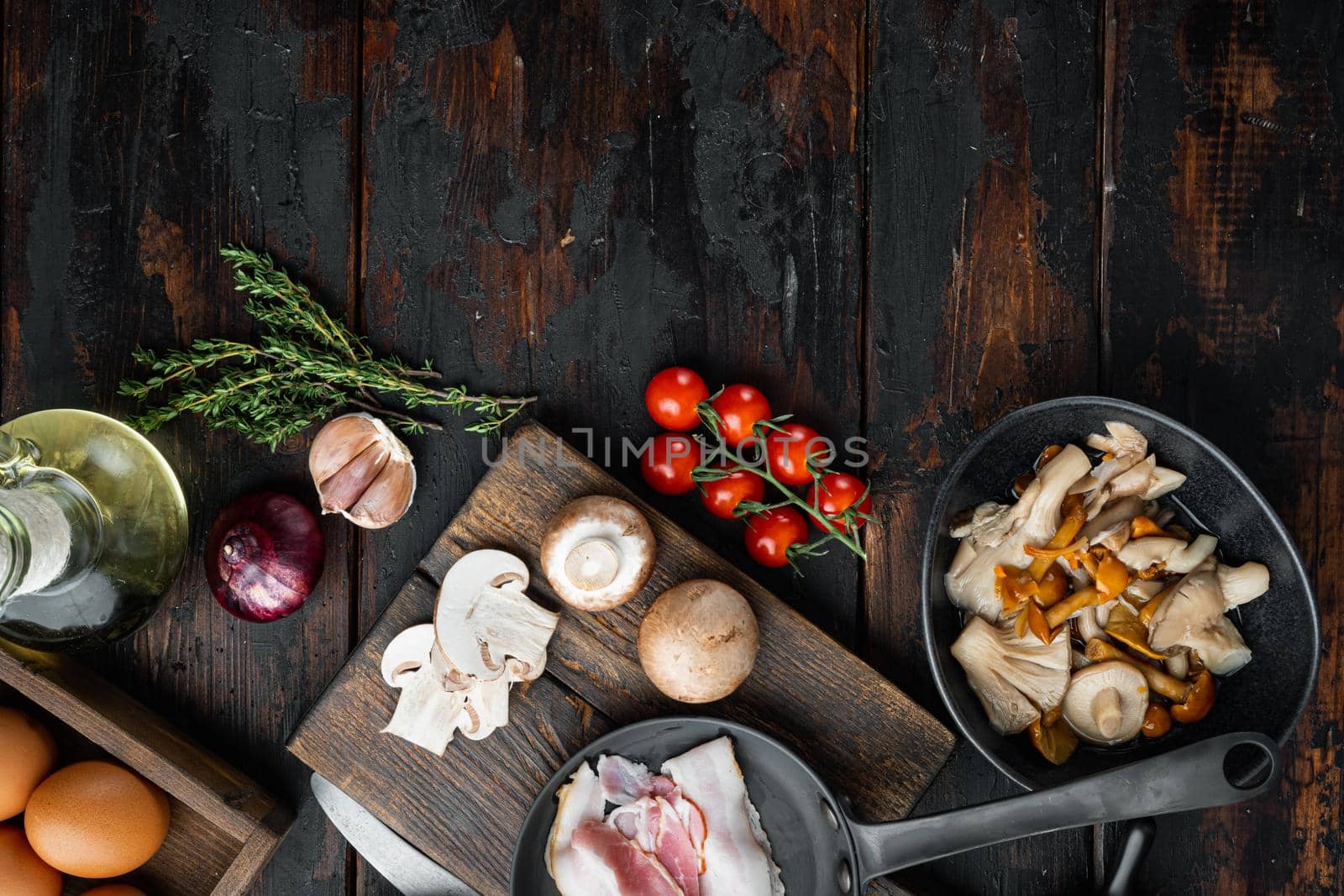 Healthy breakfast ingredients for fried eggs set, on old dark wooden table background, top view flat lay , with space for text copyspace