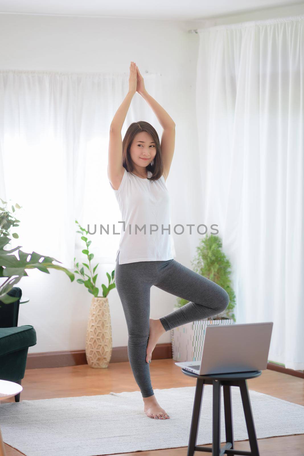 Beautiful asian woman staying fit by exercising at home for healthy trend lifestyle