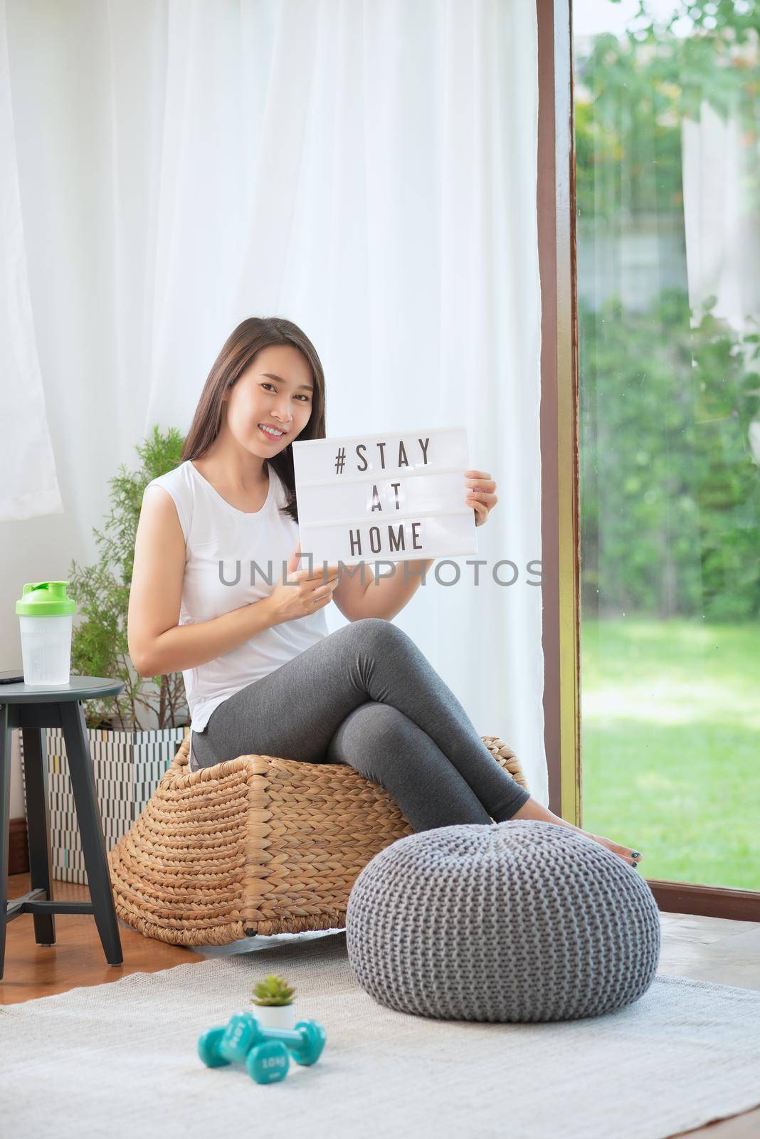 Beautiful asian woman staying fit by exercising at home for healthy trend lifestyle