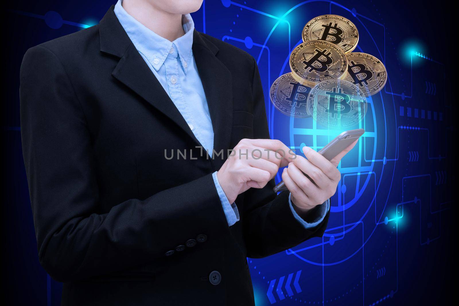 Business woman use smartphone technology invest in Bitcoin.Conceptual design for technology of Cryptocurrency and money investing.