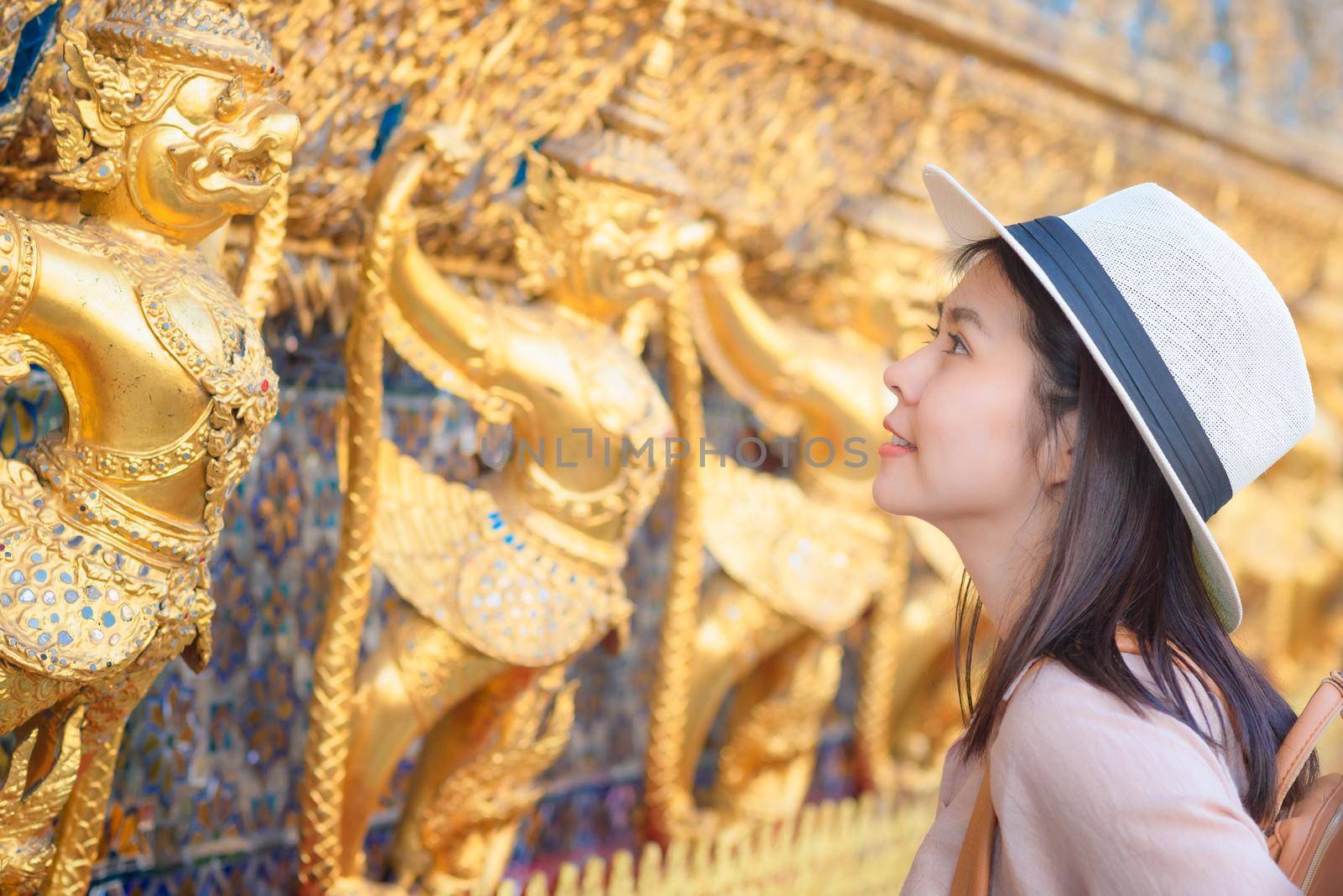 Beautiful asian tourist woman smile and enjoy travel on Vacation in Bangkok at Thailand