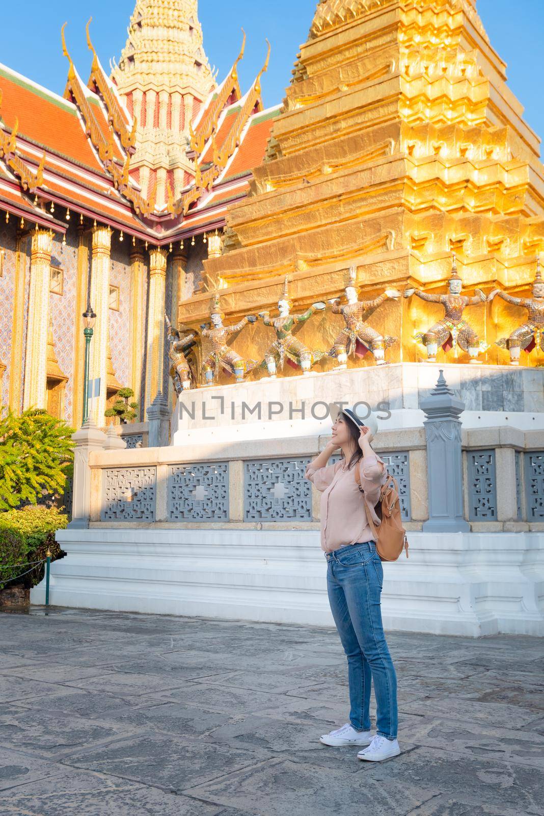 Beautiful asian tourist woman enjoy travel on Vacation in Bangkok at Thailand by Nuamfolio
