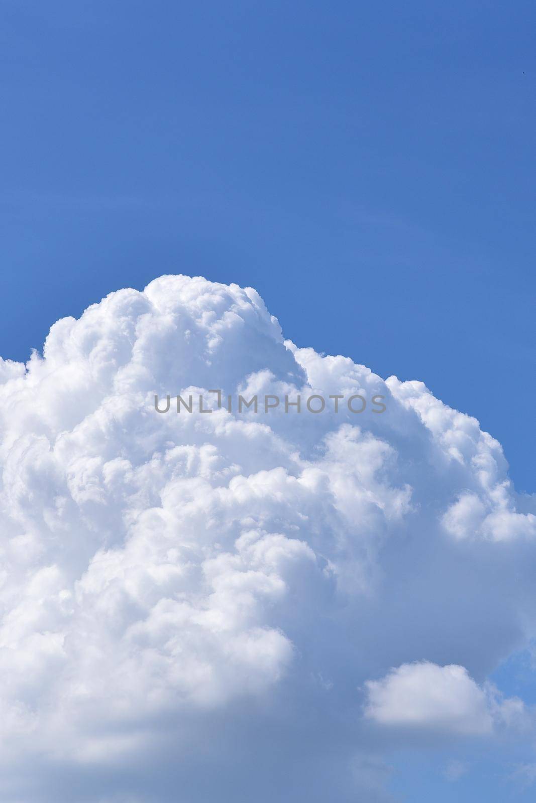 Beautiful nature white cloud on clear blue sky background.Photo for nature cloudscape and multi purpose use.

