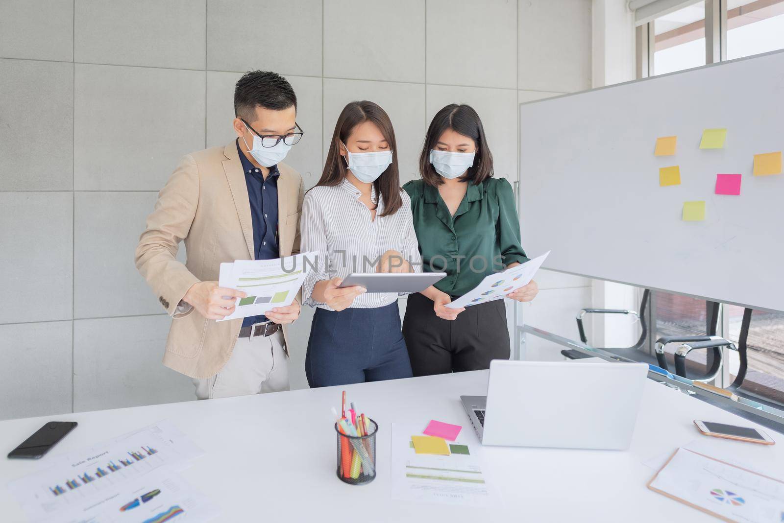 Business employees wearing mask during work in office to keep hygiene follow company policy.Preventive during the period of epidemic from coronavirus or covid19.