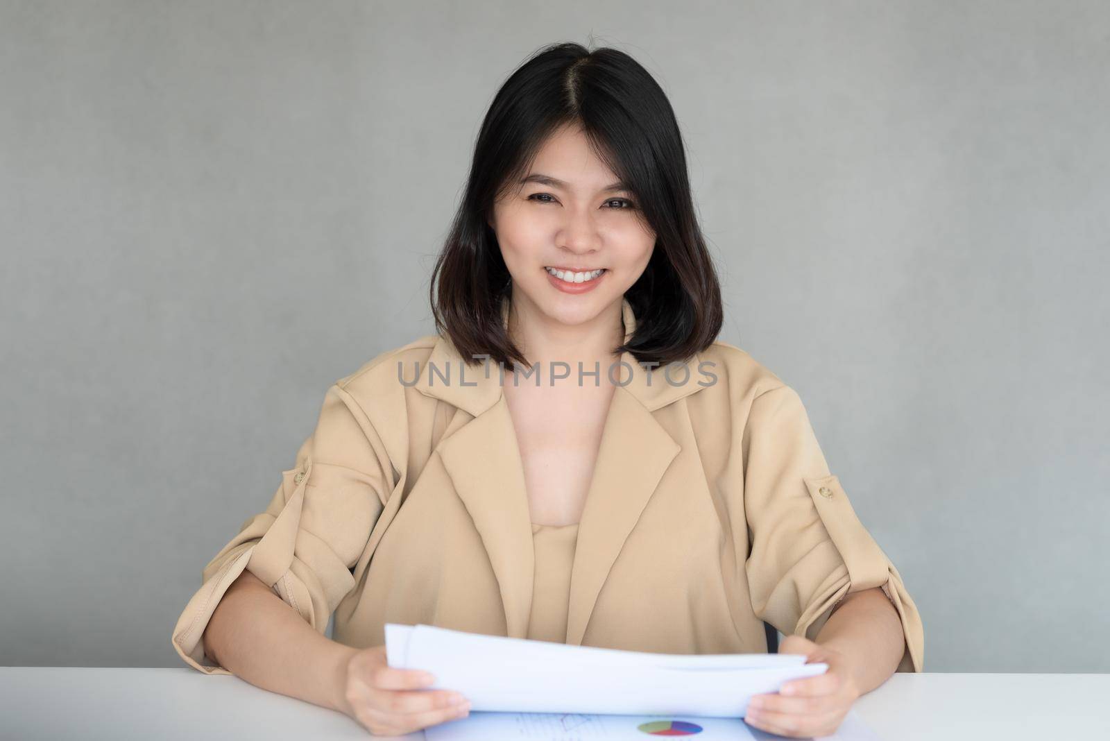 Business employee enjoy and happy to work at company office with positive attitude. by Nuamfolio