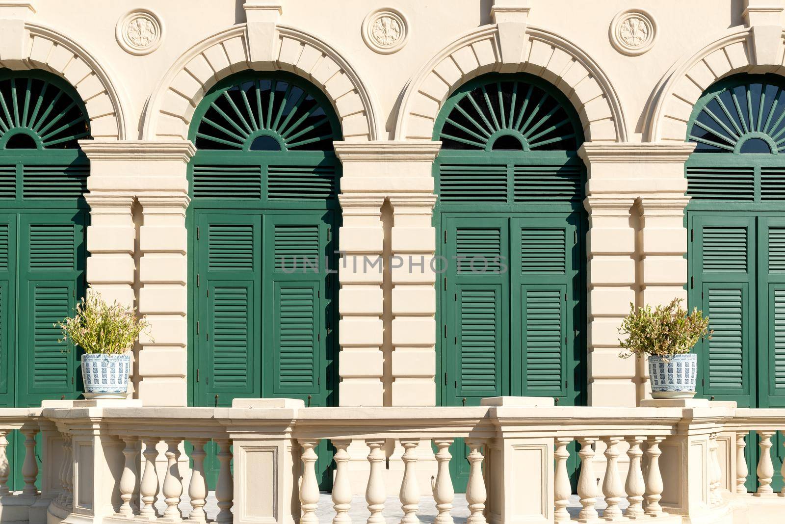 Beautiful architecture white windows with decorative frame of ancient classical building. by Nuamfolio
