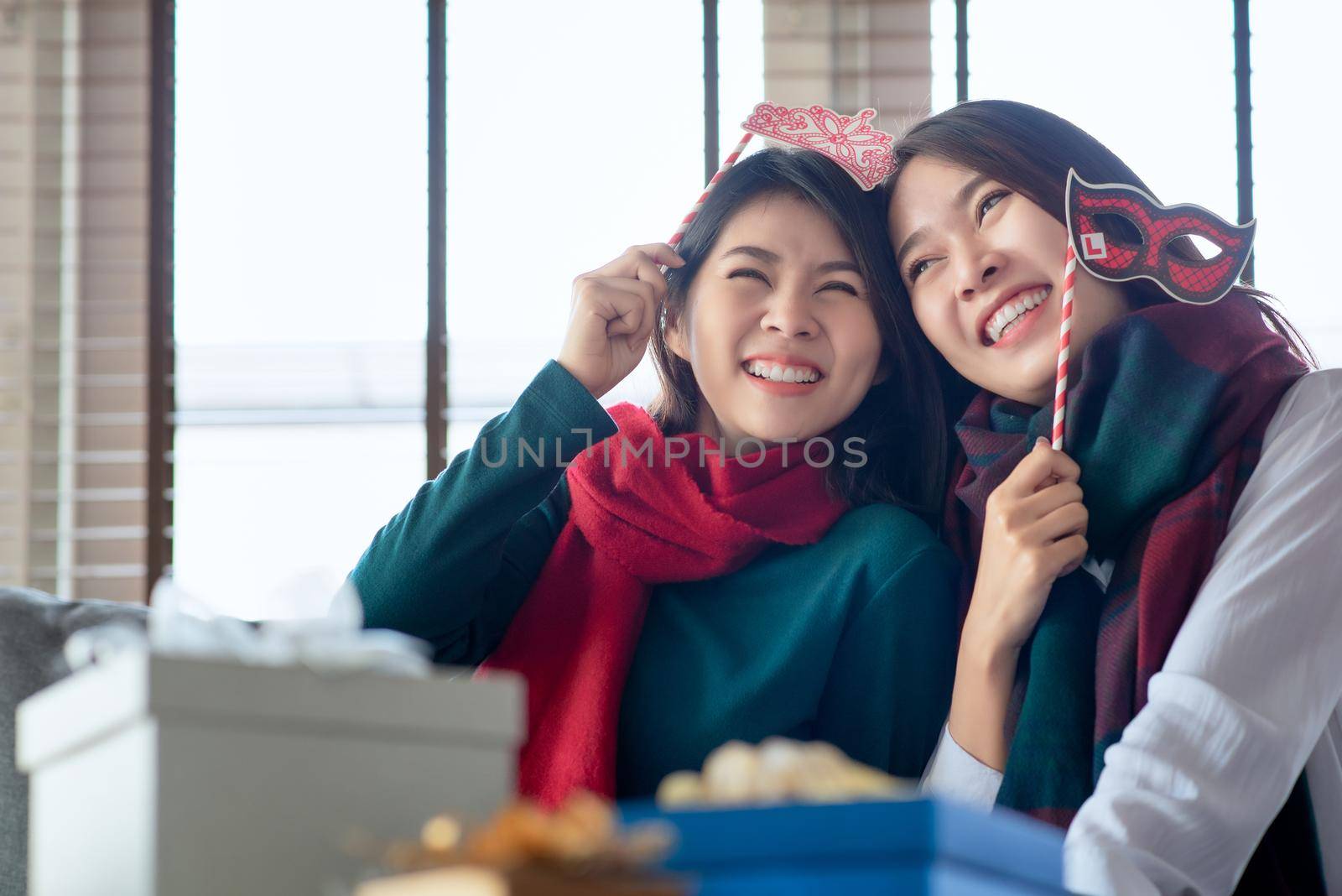 Two Females enjoy to celebrate Christmas and new year party at home in December
